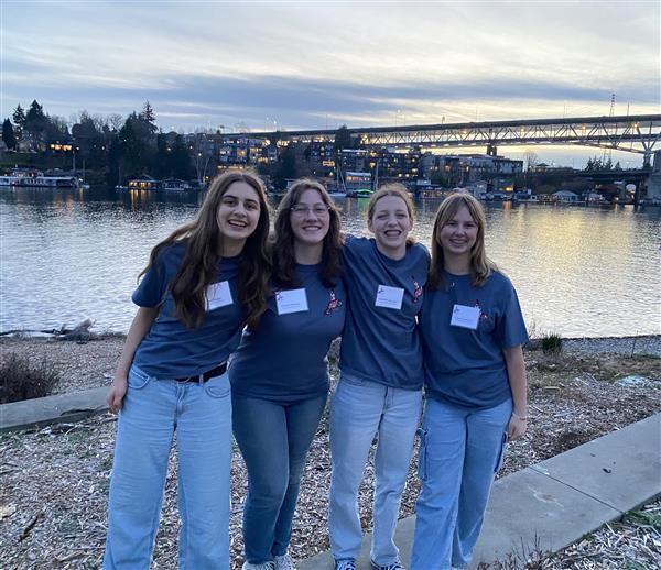  Four smiling FHHS students